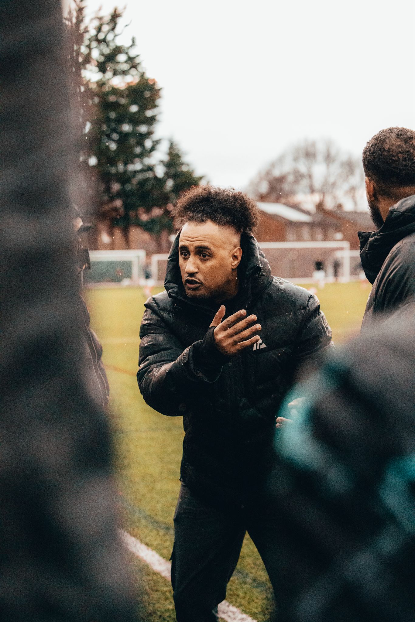 Coach delivering a team talk