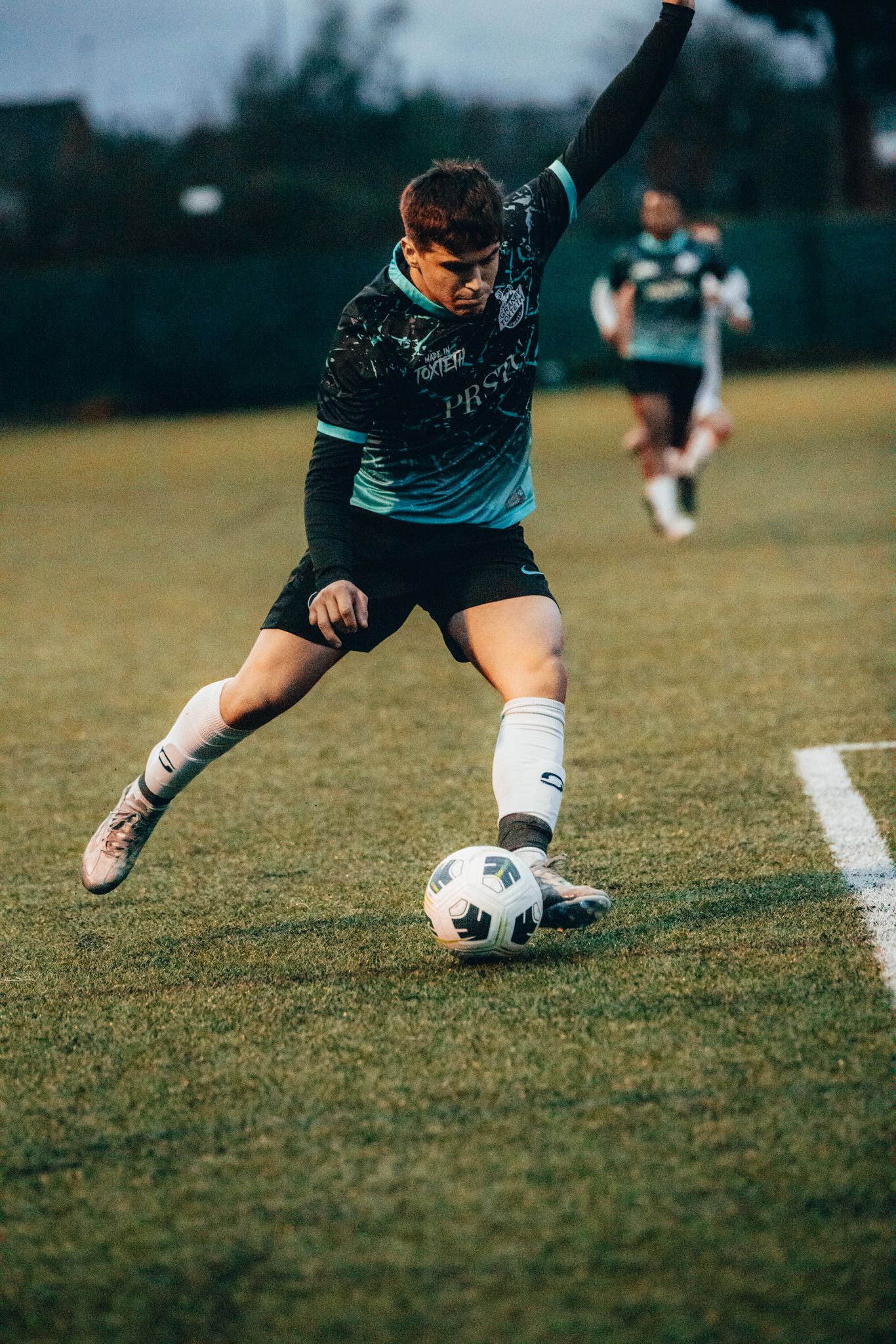 Night match — player striking the ball